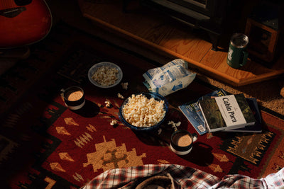 Still life of popcorn and hot chocolate in the living room of the Cowboy Cabin at the Bucking Moose in West Yellowstone, Montana